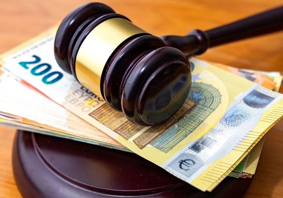 Gavel resting on euro banknotes.