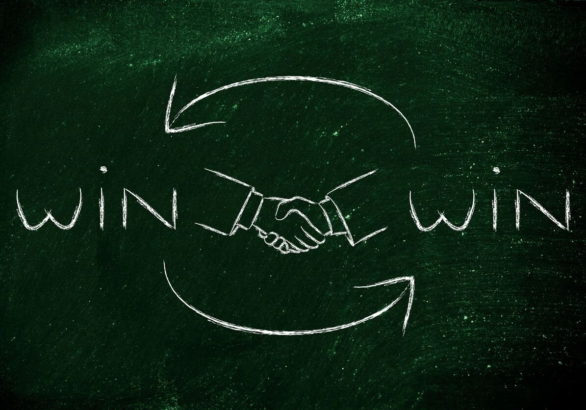 Win-win concept with handshake and arrows.