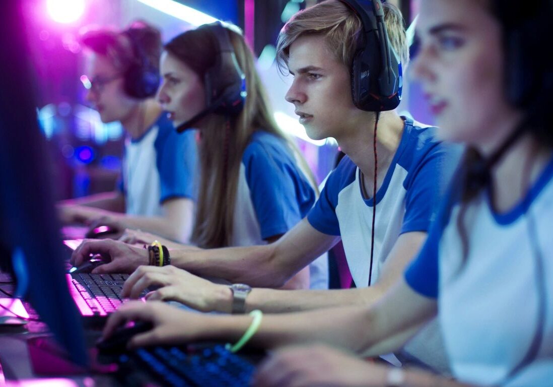 Team playing video games in competition.