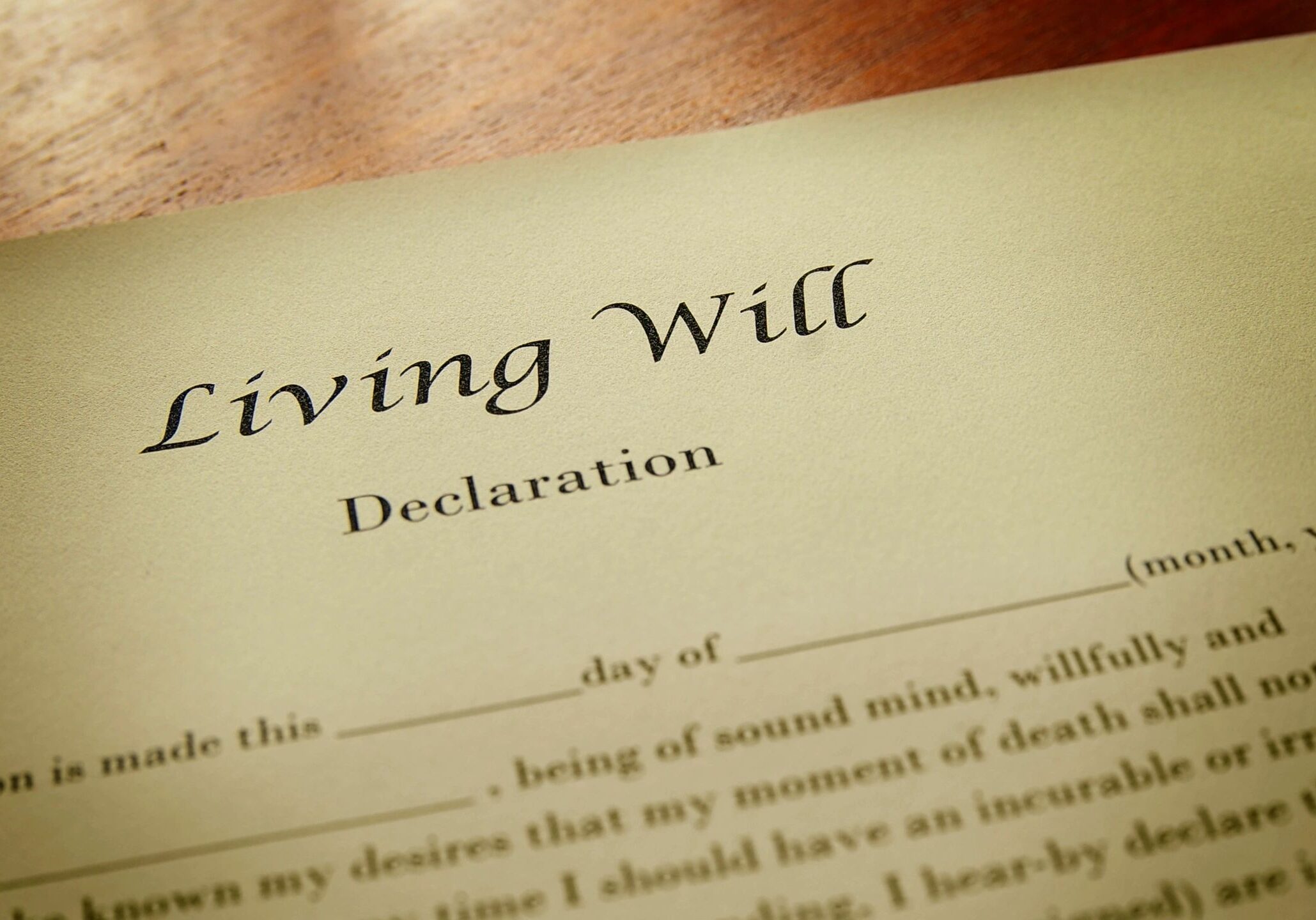 Living will document on wooden surface.