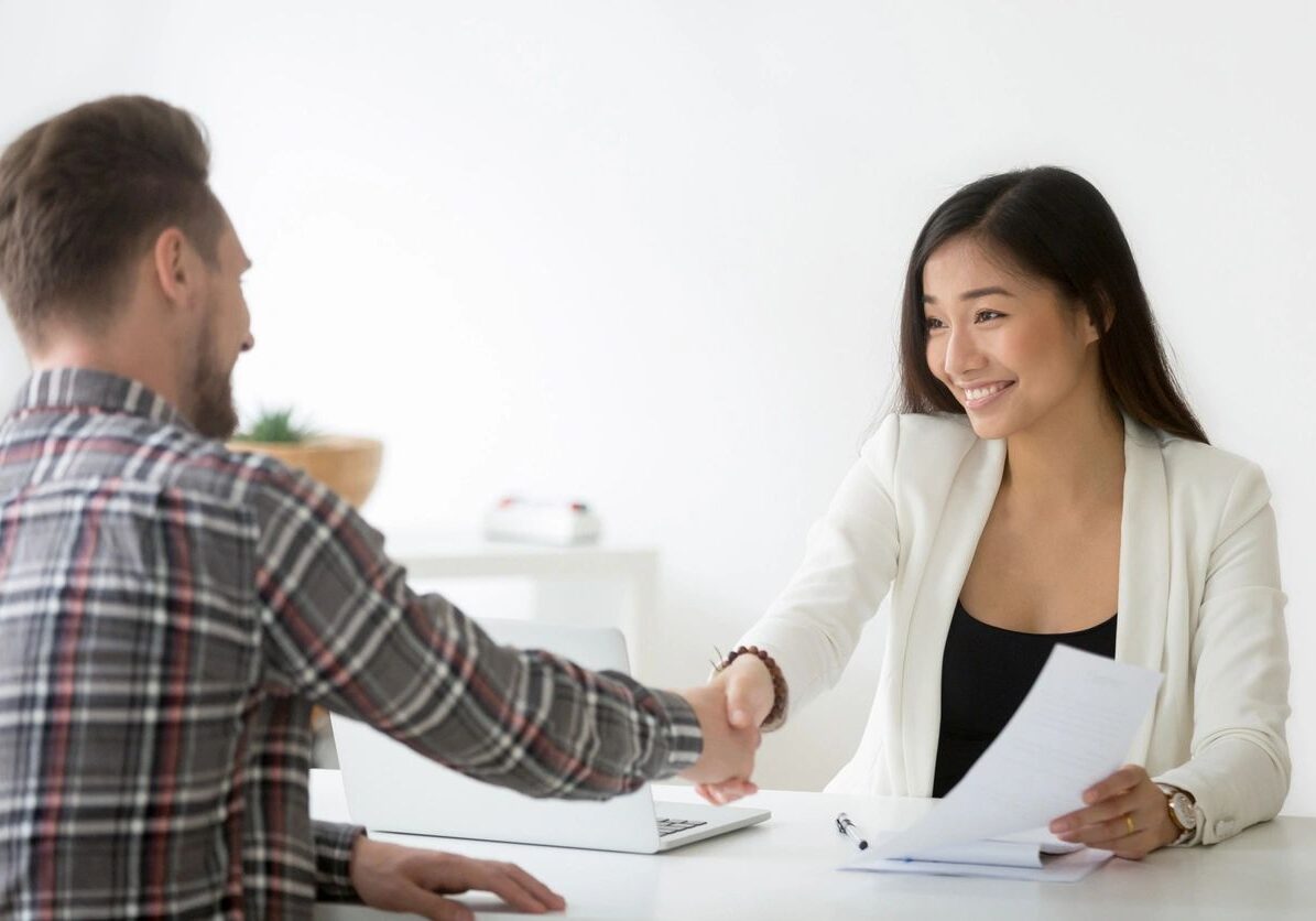Handshake during a job interview meeting.