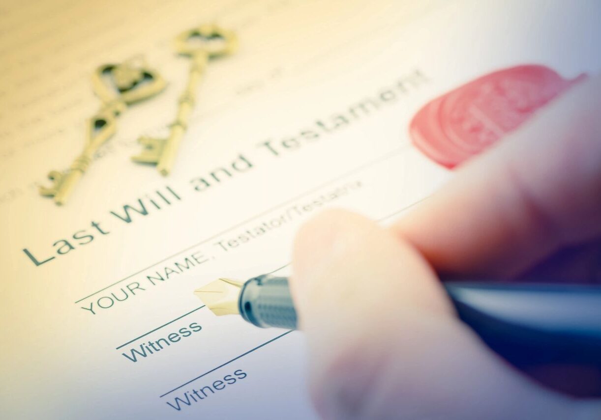 Signing a last will and testament document.